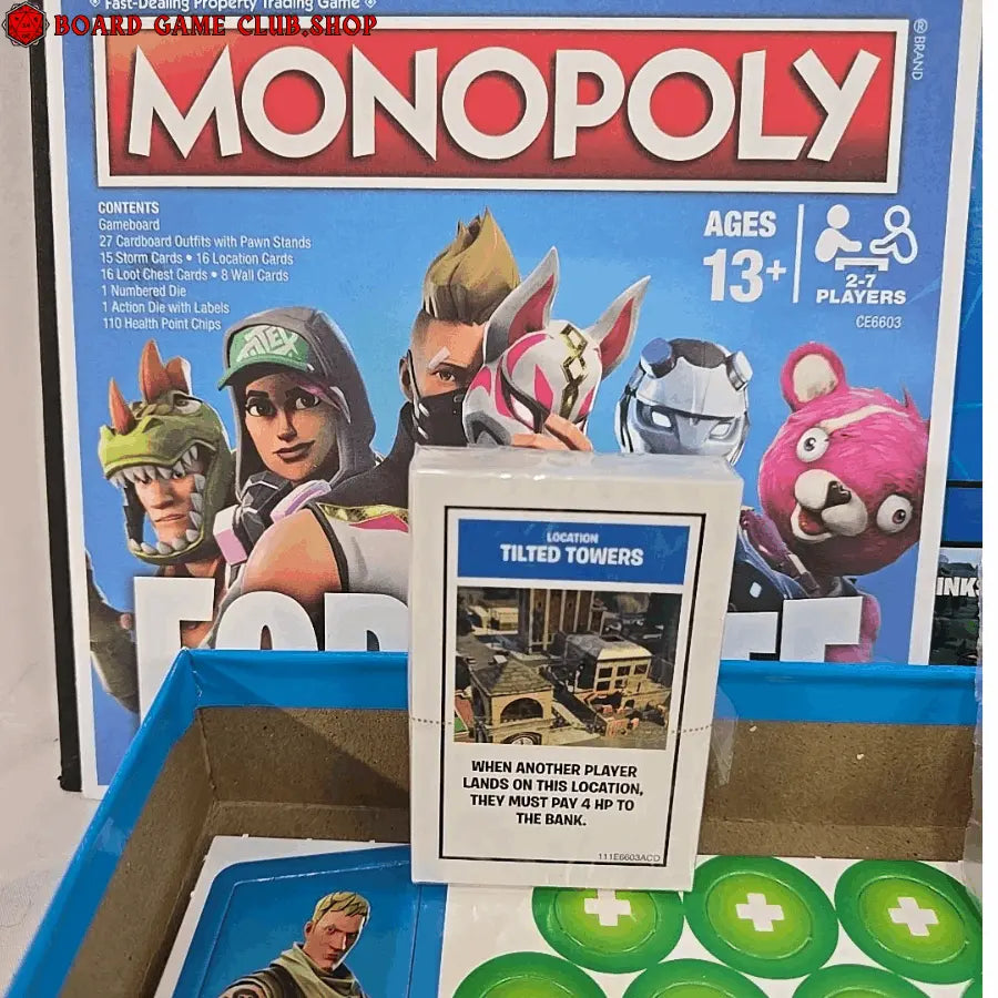 Monopoly Fortnite Edition board game featuring iconic characters and location cards like Tilted Towers