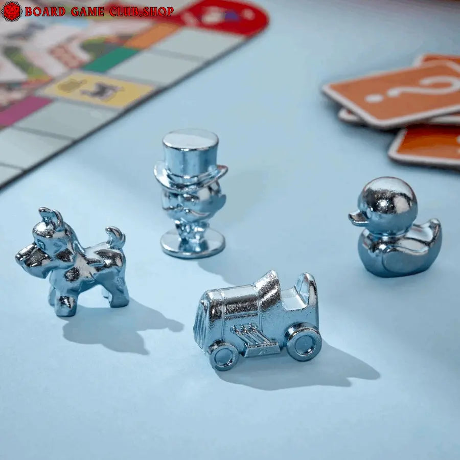 Monopoly Go game pieces including dog, hat, car, and duck in shiny metal finish