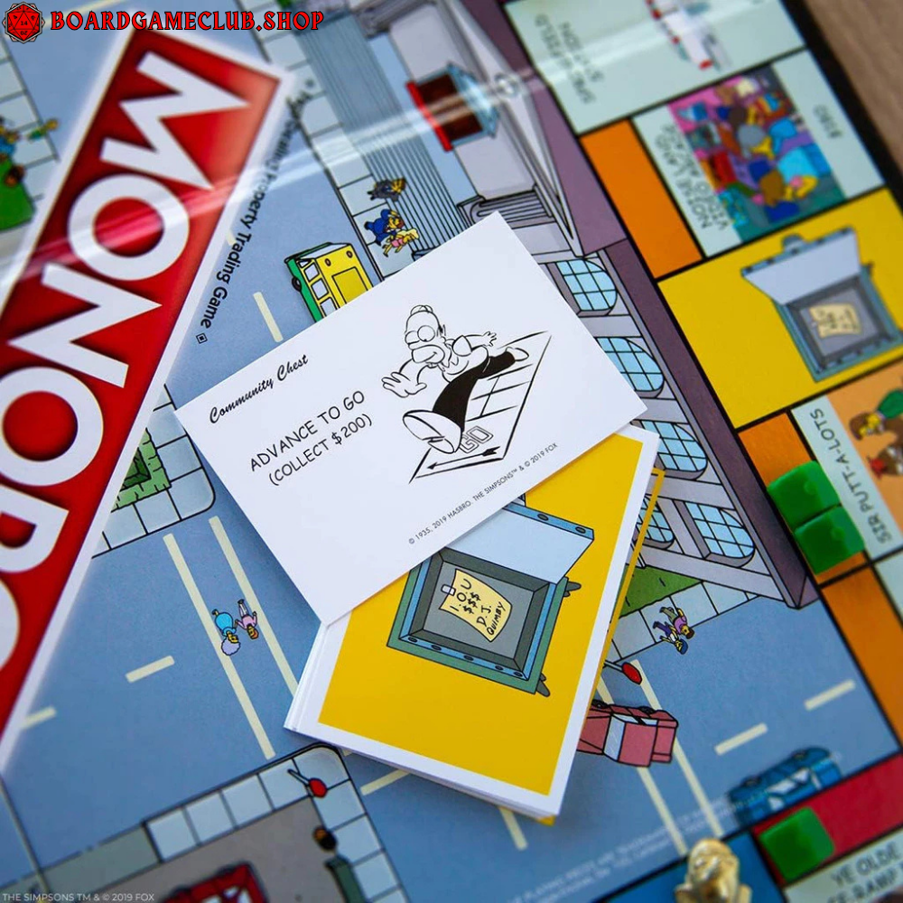 Monopoly The Simpsons Board Game with game board, community chest cards, and colorful pieces